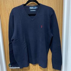 Polo Ralph Lauren Men's V-Neck Sweater L Condition: Pre-Worn Decade/Era: 2000s Vintage Color: Navy Blue With Red Polo Horse/Equestrian Logo Material: 100% Lambswool Size: L Imperfection(S): None Noticed; Light Fading. Worn Only A Handful Of Times. Note: None Of Our Sweaters Were Stored On Hangers As They Can Rip. Hangers Were Only Used For These Photos. All Sweaters Were Sealed & Stored In Rubbermaid Bins. Make An Offer! Equestrian Logo, Men's V Neck Sweaters, Polo Horse, Polo Ralph Lauren Sweater, Red Polo, Logo Material, Horse Equestrian, 2000s Vintage, Vintage Color