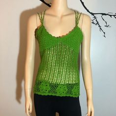 a mannequin wearing a green crochet top