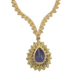 Stamped: 14K Yellow GoldTotal Necklace Weight: 21.7 GramsNecklace Length: 17 InchesNecklace Width: N/AGemstone Weight: Total Natural Tanzanite Weight is 6.56 Carat (Measures: 15.10x10.52 mm)Color: BlueDiamond Weight: Total Natural Diamond Weight is 10.11 CaratColor: F-G, Clarity: VS2-SI1Face Measures: 20.10x16.20 mmSku: [703024W] Luxury Tanzanite Necklaces For Anniversary, Luxury Tanzanite Necklace For Anniversary, Teardrop Tanzanite Jewelry In Yellow Gold, Yellow Gold Pear-shaped Diamond Necklace With Gemstone, Yellow Gold Pear-shaped Hallmarked Necklace, Hallmarked Pear-shaped Yellow Gold Necklace, Gold Teardrop Gemstones For Formal Occasions, Gold Teardrop Gemstones For Formal Events, Formal Gold Teardrop Gemstones