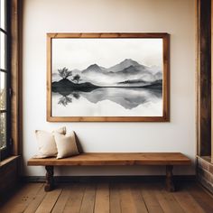 a painting hanging on the wall above a bench