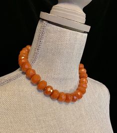 "This gorgeous carnelian choker features 27 large faceted amber color beads. Each bead is .625\" wide x .325\" thick. The over all length is approximately 17.75\". The tiny spacer beads are sterling silver. It is finished with a handmade silver toggle clasp. Length 16\" Width .625\" Additional Information: * Complimentary Gift Box! * All jewelry items come securely packaged and are mailed promptly upon payment - often same-day. * The majority of my vintage items are used and may show some wear. Faceted Amber Round Bead Jewelry, Spiritual Orange Jewelry With Faceted Beads, Adjustable Carnelian Jewelry With Faceted Beads, Faceted Orange Beaded Necklace As Gift, Orange Vintage Jewelry With Faceted Beads, Vintage Orange Jewelry With Faceted Beads, Orange Beaded Necklace With Faceted Beads, Adjustable Amber Beaded Necklace With Faceted Beads, Orange Faceted Round Beaded Necklace