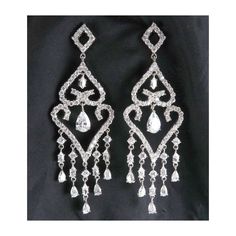 "These sparkling chandelier earrings have dozens of faceted cubic zirconia in round, pear and marquise shapes dangling from an open diamond-shape top finishing with five dangling fringes. Each earring is 3 1/8\" high and just over 1\" wide.  The stones are all set open-backed to maximize the brilliant reflections.  And these ARE brilliant; truly, much prettier than in the photos. The posts have vinyl clutches.  There are no marks on the earrings but they are very well made. Condition is excellen Diamond Shape, Shop Policies, Ear Wire, Chandelier Earrings, Essie, Diamond Shapes, Clutches, Jewelry Earrings Dangle, Pear