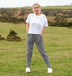 Experience ultimate comfort with our Relaxed Fit Organic Cotton Joggers for Women. Made from 100% organic cotton, these joggers offer exceptional softness and breathability. Features include an elastic waistband with drawstring, side pockets, and tapered legs with ribbed cuffs. Perfect for lounging, light workouts, or casual outings. Cotton Athleisure Joggers With Side Pockets, Relaxed Fit Joggers With Elastic Side Panels For Loungewear, Comfortable Relaxed Fit Sweatpants With Elastic Side Panels, Sporty Relaxed Fit Joggers With Pockets, Relaxed Fit Joggers With Side Pockets For Jogging, Casual Joggers For Loungewear With Elastic Side Panels, Cotton Gym Pants, Everyday Athleisure Activewear With Tapered Leg, Everyday Athleisure Tapered Leg Activewear