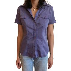 Purple Short Sleeve Blouse With Buttons, Purple Short Sleeve Button Blouse, Classic Fitted Blouse With Pockets, Fitted Purple Top With Button Closure, Fitted Purple Top With Buttons, Purple Short Sleeve Shirt With Buttons, Purple Short Sleeve Top With Button Closure, Casual Fitted Blouse With Covered Buttons, Fitted Office Blouse With Pockets