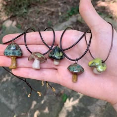 These mushroom necklaces feature handmade ceramic pendants. These unique and one of a kind necklaces are perfect for anyone who loves nature and earth tones. If you are trying to get away from mass produced, unoriginal jewelry that breaks in a year, these handmade necklaces are a perfect option. These necklaces are water resistant. Cute Mushroom Necklaces, Gremlincore Jewelry, Bohemian Adjustable Necklace With Mushroom Design, Adjustable Bohemian Necklace With Mushroom Design, Forestcore Jewelry, Goblincore Accessories, Cottage Core Accessories, Clay Necklace Ideas, Schmuck Aesthetic