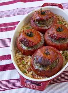 tomatoes and rice in a casserole dish on a table