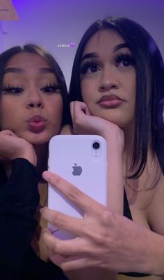 two women taking a selfie with an iphone