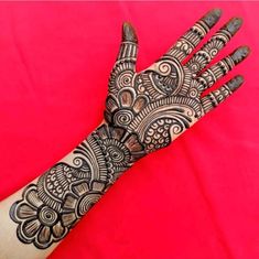 the hand is decorated with intricate designs