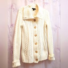 Very Cosy Style And Company Cardigan, Cuff Sleeve, High Buttom Up Collar .So Many Ways To Wear This Treasure. Great With Bulky Or Regular Scarf .Wear Layered. Or Just Over Light Top. Excellent Pre-Owned Condition. White/Cream Perfert Addition To Wardrobe. White Sweater Coat With Button Closure, White Cable Knit Button-up Outerwear, Trendy White Cable Knit Outerwear, White Cotton Cable Knit Cardigan, Casual White Cable Knit Sweater Coat, Fitted White Casual Sweater Coat, Cozy White Button-up Cardigan, White Button-up Sweater For Fall, White Trendy Cardigan With Ribbed Cuffs