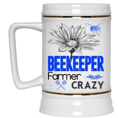 a beer mug with the words beekeeper farmer crazy written in blue and gold on it