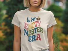 🎉 Celebrate your new chapter with this fun retro "In My Empty Nester Era" T-Shirt! Perfect for parents who are embracing the changes of an empty house and enjoying their newfound freedom. This colorful typography tee makes a thoughtful gift for any empty nesters. Wear it to show off your pride and joy in your new stage of life! 🎨👕 Product Features: Fabrication: Solid Colors: 100% Airlume combed and ring-spun cotton, 32 single 4.2 oz, Black Mineral Wash: 100% Airlume combed and ring-spun cotto Colorful Typography, Empty House, Typography Tees, Empty Nesters, Lifestyle Change, Clothing Items, Thoughtful Gifts, Labour Day, Product Features