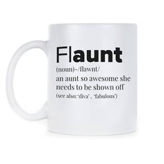 a white coffee mug with the words flaunt printed on it and black lettering