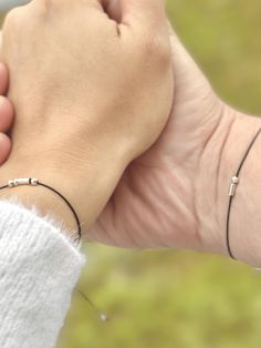 A perfect, personalized gift for partners or best friends. Celebrate love, connection, and remembrance with our Minimalist Morse Code Bracelet. Whether it's for your boyfriend, husband, brother, father, or godfather, this bracelet makes a thoughtful gift for birthdays, anniversaries, or any special occasion. It's not just a piece of jewelry, it's also a meaningful symbol that represents your unique bond. Ideal as a gift for couples, this timeless design also serves as a keepsake for sisters or a White Gold Friendship Bracelets, Adjustable Hypoallergenic Sterling Silver Anniversary Bracelet, Adjustable Hypoallergenic Sterling Silver Bracelet For Anniversary, Minimalist Hypoallergenic Bracelets For Promise, Dainty Silver Promise Bracelets, Dainty Silver Bracelets For Promise, Minimalist Initials Bracelet For Anniversary, Minimalist Sterling Silver Jewelry For Friendship, Adjustable White Gold Name Bracelet