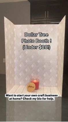 a photo booth with a candle on the floor and a sign that says dollar tree photo booth under $ 20