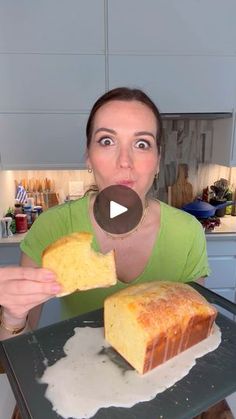 a woman holding a piece of cake on top of a pan