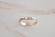 Create your own beautiful set of name rings to show off the people closest to your heart! So simply pretty! Our 3mm high quality 14k Gold-Filled band rings fit one date, name or word in your choice of font. Our rings stack beautifully together, so purchase up to 3 name band rings total for one finger. Please keep the total characters per ring to around 20 max. Up to 3 name ring bands with two spacers will fit on one finger, and we recommend sizing to the next whole size up if you are stacking 3 Custom Name Stackable Rings In 14k Gold For Anniversary, 14k Gold Custom Name Engraved Ring For Promise, 14k Gold Engraved Ring With Custom Name For Promise, Custom Name 14k Gold Stackable Rings For Anniversary, 14k Gold Stackable Rings With Custom Name For Anniversary, Custom Name 14k Gold Engraved Promise Ring, Custom Name Engraved 14k Gold Promise Ring, Custom Name Stackable Promise Rings, Custom Name Stackable 14k Gold Rings For Wedding