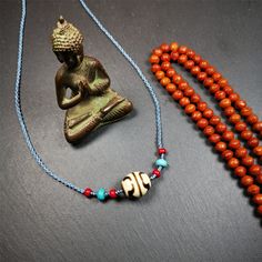 This necklace was hand-woven by Tibetans from Baiyu County, the main bead is a lotus dalo dzi bead, paired with turquoise and agate beads,about 40 years old. It can be worn not only as a fashionable accessory but also holds cultural and religious significance. The length of the necklace can be adjusted, the maximum circumference is about 60cm. Dzi Beads Necklaces, Interesting Necklaces, Tibetan Culture, Fire Agate, 30 Years Old, Cool Necklaces, Precious Jewelry, Good Fortune, Significant Other