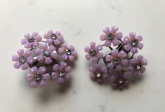 "Beautiful layered flower earrings with rhinestones. Clip ons. Good condition. Molded plastic flowers. 1960's. 1 1/2\" round" Vintage Flower-shaped Earrings For Party, Vintage Purple Flower Earrings, Purple Flower-shaped Pierced Earrings, 60s Jewelry, Vintage Flower Shaped Clip-on Earrings, Vintage Pink Flower-shaped Earrings, Plastic Molds, Plastic Flowers, Jewelry Statement