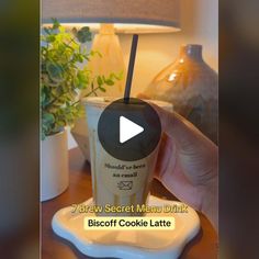 a person is holding a drink in their hand with the caption, 7 brew secret menu drink biscuit cookie latte