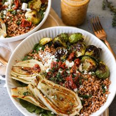 two white bowls filled with different types of food