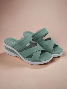 Elevate your style and comfort with our Siketu Tetra Cushioned Wedge Sandals. These dusty green sandals feature a cushioned wedge for all-day support, making them perfect for both casual and dressy occasions. Add a touch of sophistication to any outfit with the sleek design and comfortable fit. 2.36'' heel Slip-on PU upper Synthetic Arch support footbed™ Cushioned Insole™ Anti-skid rubber sole