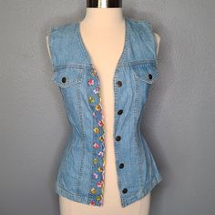 Nwt Vintage 90s Sleeveless Floral Embroidered Denim Button Down Blouse Shirt Brand: Switch Usa Size: S Floral Embroidered Design Hides Buttons Two Faux Front Pockets Made In The Usa 100% Cotton C-U-1 Button-up Medium Wash Vest For Spring, Medium Wash Button-up Vest For Spring, Spring Denim Button-up Vest, Summer Denim Top With Floral Embroidery, Spring Denim Blue Buttoned Vest, Floral Embroidered Denim Top For Summer, Vintage Denim Top With Buttons For Summer, Denim Blue Summer Vest With Buttons, Casual Embroidered Denim Vest For Spring