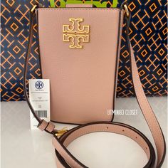 Authentic Tory Burch Phone Crossbody Bag , Leather, Brand New With Tag. Light Meadowsweet Color, Gold Hard Wear. This Is Brand New Tory Burch Bag Please Consider If Make Offer. Seller Pay 20% Posh Fees! All My Items Will Wrap With Tissue Paper Check My Closet For More Brand New Brands Bags&Wallets!! Ship Same Day Or Next Day!! Thanks For Shop With Me Luxury Crossbody Phone Bag With Removable Pouch, Luxury Leather Phone Bag With Top Handle, Designer Phone Bag With Removable Pouch For Travel, Designer Travel Phone Bag With Removable Pouch, Luxury Leather Phone Bag With Adjustable Strap, Luxury Leather Satchel Phone Bag, Elegant Leather Phone Bag For Shopping, Elegant Leather Phone Bag, Rectangular Phone Bag With Gold-tone Hardware For Travel