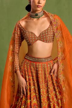 Orange can can attached lehenga with geometric-floral mughal print embellished by sequin and beads. Comes with bead embellished, dabka embroidered padded blouse and dupatta. - Aza Fashions Orange Choli With Dupatta For Reception, Traditional Orange Sets For Reception, Orange Zari Work Sets For Wedding, Orange Choli With Resham Embroidery For Wedding, Orange Art Silk Lehenga For Wedding, Orange Sets With Zari Work For Wedding, Orange Wedding Sets With Zari Work, Orange Choli With Traditional Drape For Reception, Bollywood Orange Choli For Reception