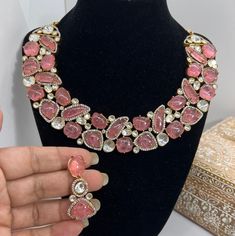 This Gorgeous Sabyasachi inspired with Moissanite Necklace with matching earrings. Comprises of Fine Oversized Uncut Kundan polki stones and Ruby color hangings This necklace is flexible and takes the shape of the neck. Fine quality and craftsmanship. Perfect for desi weddings. Necklace comes in drawstring cord therefore adjustable Earrings length: Approx 2.5 inches Pink Meenakari Bridal Necklace For Party, Meenakari Choker Necklaces For Parties, Pink Stone Work Necklace For Party, Pink Stone Work Necklaces For Party, Pink Party Jewelry With Stone Setting, Party Meenakari Choker, Elegant Pink Meenakari Choker, Pink Meenakari Jewelry Sets For Party, Heavy Bollywood Party Necklace