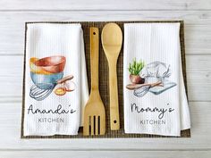 two kitchen towels with wooden utensils on them