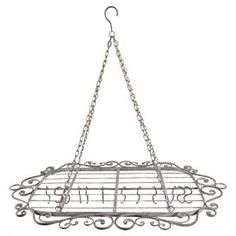 an old fashioned metal hanging pot rack with letters on the front and bottom, attached to chains