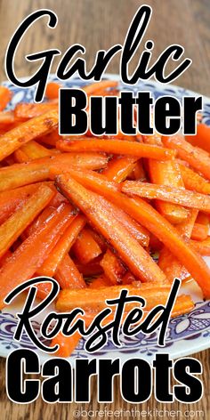 garlic butter roasted carrots on a blue and white plate