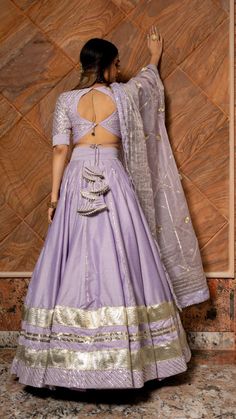 PRODUCT DESCRIPTION: LEHENGA: Cotton silk BLOUSE: Cotton silk DUPATTA: Organza COLOR: lilac work : Gotta lace and phool work. LINING: CANCAN with cotton lining No. Of Components : Set of 3 POTLI BAG : INCLUDED Wash Care : Dry Clean MADE TO ORDER SKU#: 11423164PR Disclaimer: All our pieces are handcrafted in our manufacturing unit .We Ensure that our pieces are shot professionally under controlled lighting. Colours tend to be perceived differently depending on factors such as shot angles, lightin घाघरा चोली, Lengha Blouse Designs, Pola Blus, Simple Lehenga, Latest Model Blouse Designs, Backless Blouse Designs, New Saree Blouse Designs, Lehenga Designs Simple, Fashionable Saree Blouse Designs