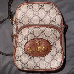 This Is A Vintage Gucci Gg Supreme Neo Vintage Mini Bag, Still Brand New. No Box Or Cover As This Was A Gift Given To Me! Been Only Used Once. This Was A College Gift That Was Given To Me And Hadn’t Been Really Used. Gucci Beige Bag With Logo, Designer Logo Rectangular Shoulder Bag, Designer Brown Bag With Logo, Designer Brown Bags With Designer Logo, Gucci Gold Monogram Canvas Bag, Gucci White Bag With Removable Pouch, White Gucci Bag With Removable Pouch, Elegant Everyday Shoulder Bag With Designer Logo, Designer Gucci Bag With Logo