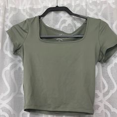 Never Worn! Army Green Color Basic Green Cropped Top, Spring Workout Tops With Short Sleeves, Spring Workout Short Sleeve Tops, Scoop Neck Spring Workout Top, Green Crop Top For Workout, Green Casual Workout Top, Casual Green Workout Top, Green Workout Crop Top, Basic Green Scoop Neck Tops