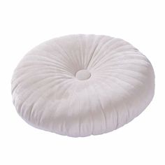 a white round pillow on a white background