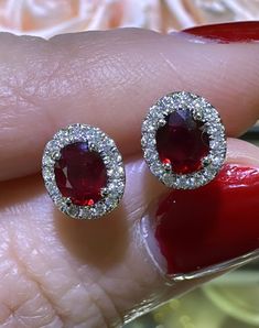 Indulge in luxurious elegance with our 1.13carat ruby and diamond halo stud earrings. Embrace the stunning contrast of the vibrant ruby and dazzling diamonds in a classic halo design. Elevate any outfit with this exquisite touch of sophistication and make a statement that will leave a lasting impression. Metal: 18K White GoldDiamond Weight (32): 0.16ct twRuby Weight (2): 0.97ct twBacking: Push Backs Dimensions: L 8mm X 7mm Halo Stud Earrings, Halo Design, Halo Earrings Studs, Diamond Halo, Rose Gold Earrings, Halo Diamond, Halo, Ruby, Diamonds