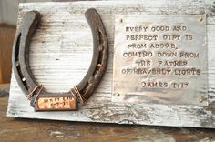 an old horseshoe with a plaque attached to it