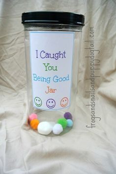 a jar filled with candies sitting on top of a white sheet