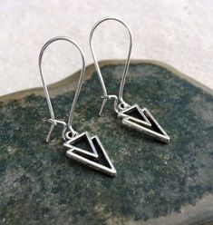 "Mod minimalist geometric earrings. Dainty yet striking! Perfect for everyday, year round wear. They measure 5/8\" long by 3/8\" wide and hang from 1\" silver kidney style ear wires that lick and match. Made from allergy free plated silver. Thanks so much for stopping by! Please take a moment and visit the rest of my Etsy shop. I have many more unique jewelry designs to choose from. Lots of great gift ideas too! 🌸 Tiger Flower Jewelry 🌸 🌸 Inspired by Nature 🌸" Adjustable Geometric Minimalist Earrings, Adjustable Minimalist Geometric Earrings, Tiger Flower, Dainty Dangle Earrings, Small Silver Earrings, Arrow Earrings, Bird Earrings, Bird Jewelry, Earrings Dainty