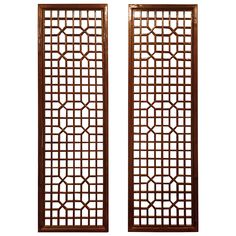 two wooden doors with lattice designs on them