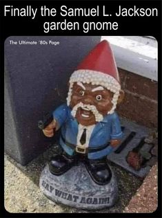 a garden gnome sitting on the ground next to a wall with text that reads, finally the samuel l jackson garden gnome