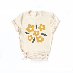 Looking for a cute versatile top to wear this summer? Make sure to grab one of our Yellow Daisies tees! This soft and comfortable graphic tee is the perfect top for any outfit. It can be paired with biker shorts, jeans, or even a simple skirt/dress! This tee is true-to-size, so be sure to order your regular t-shirt size! If you are looking for a more oversized look, make sure to size up! Biker Shirt Outfit, Biker Shirts, Yellow Daisies, Shirt Outfit, Dress Skirt, Top Shirt, Daisy, Graphic Tees, Top Outfits