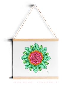 a painting hanging on a wall with a flower painted on the front and back of it