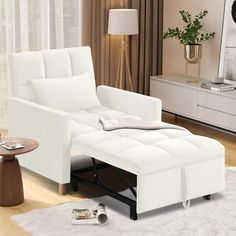 a white chair and ottoman in a living room