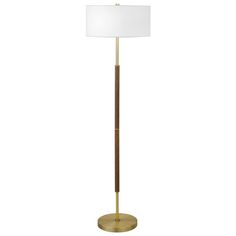 a floor lamp with a white shade on the top and a gold metal base, in front of a white background