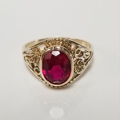 Thanks for shopping our vintage estate store. We tend to sell well below wholesale and truly hope you enjoy all of our items. Many of the items are one of a kind, so please enjoy scrolling through the pictures and hopefully something will catch your eye. Estate 10k yellow gold created .50ct ruby vintage filigree ring. Beautiful ring and will make a nice present. Ruby is oval created. Ring size: 4.5 Setting: 3/8" 8mm Band width: 1.5mm Weight: 2.01 grams Beautiful ring. Marked 10k. Cheap Antique Oval Jewelry, Vintage Oval Gemstone Signet Ring, Estate Oval Jewelry For Anniversary, Estate Style Oval Jewelry For Anniversary, Antique Oval Signet Ring With Diamond Cut, Vintage Oval Signet Ring For Anniversary, Vintage Oval Diamond Cut Signet Ring, Vintage Oval Signet Ring With Diamond Cut, Estate Style Oval Yellow Gold Rings