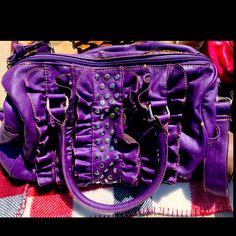 This Deep Purple Bag Is Perfect For That Girl Who Likes A Little Pizzaz In Their Life. The Gold Studs Accent The Front Of The Bag Allowing You To Show Off Without Having It Hurt You As You Wear It As A Crossbody Bag. The Handbag Has Handles To Hold Or To Wear With The Long Adjustable Straps - Whatever Your Occasion Is! Like Brand New- No Scratches, Discoloration Or Scuffs. Purple Bag, Purple Bags, Gold Studs, Purple Gold, Deep Purple, Cross Body Handbags, Adjustable Straps, Satchel, Crossbody Bag