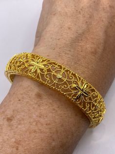 Vintage Bangle Bracelet Golden Bronze filigree  22k over bronze Indian wedding bangle  Fits a small to average wrist    All jewelry is shipped free in the US in a nice gift box.   Check out our over a THOUSAND great reviews Engraving is $4 per letter and is not always perfect depending on the piece. It can take a few days if the jeweler is busy. This is payable to Paypal Judithsltd@gmail.com Adjustable Gold Wedding Bracelet With Intricate Design, Adjustable Gold Bracelet With Intricate Design For Wedding, Adjustable Intricate Design Gold Wedding Bracelet, Elegant Gold Cuff Bracelet For Ceremonial Use, Intricate Gold Bracelet For Weddings, Intricate Design Gold Bracelet For Wedding, Wedding Gold Bracelet With Intricate Design, Ornate Gold Bracelets For Formal Occasions, Gold Jubilee Bracelet Bangle For Wedding