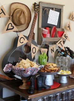 a table topped with lots of food next to a sign that says condiments